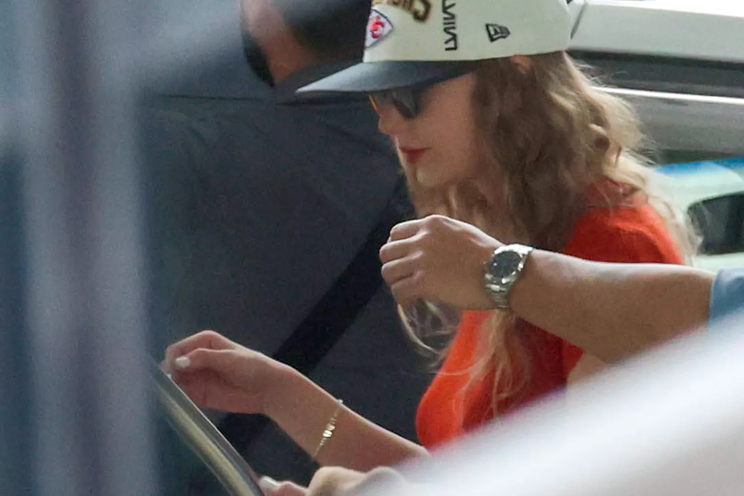 Taylor Swift Keeps it Sporty and Romantic in Melbourne: Chiefs Gear and "TNT" Bracelet Spark Fan Buzz